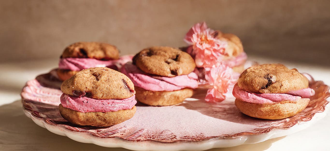 Five Cherry Berry Whoopie Pies on a pink napkin on a plate